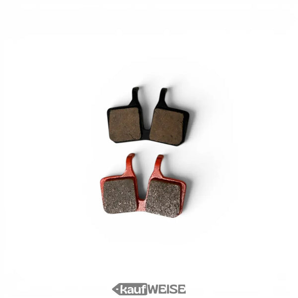 A pair of magura 9.P performance organic brake pads with black and red metallic backing plates for mt5 mt7